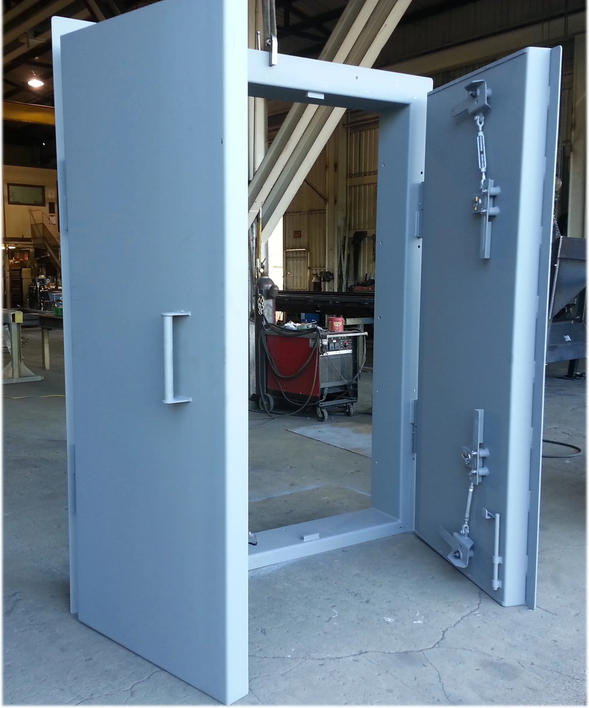 two steel doors open in a garage